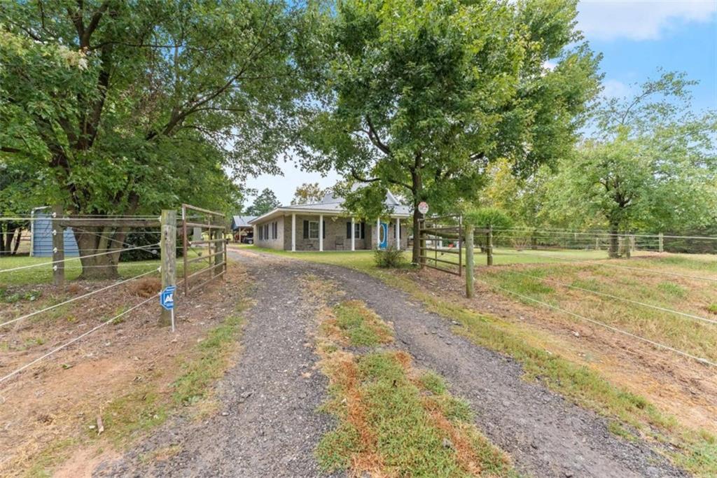 3322 Cheek Pulliam Road Royston, GA 30662 - Photo 5 of 61 a view of a house with a backyard