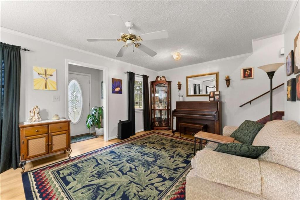 3322 Cheek Pulliam Road Royston, GA 30662 - Photo 8 of 61 a living room with furniture and a dresser