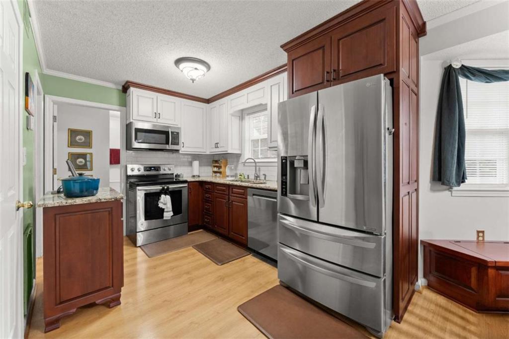3322 Cheek Pulliam Road Royston, GA 30662 - Photo 10 of 61 a kitchen with stainless steel appliances and refrigerator