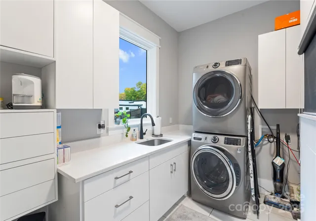 a kitchen with kitchen island a sink stove and cabinets