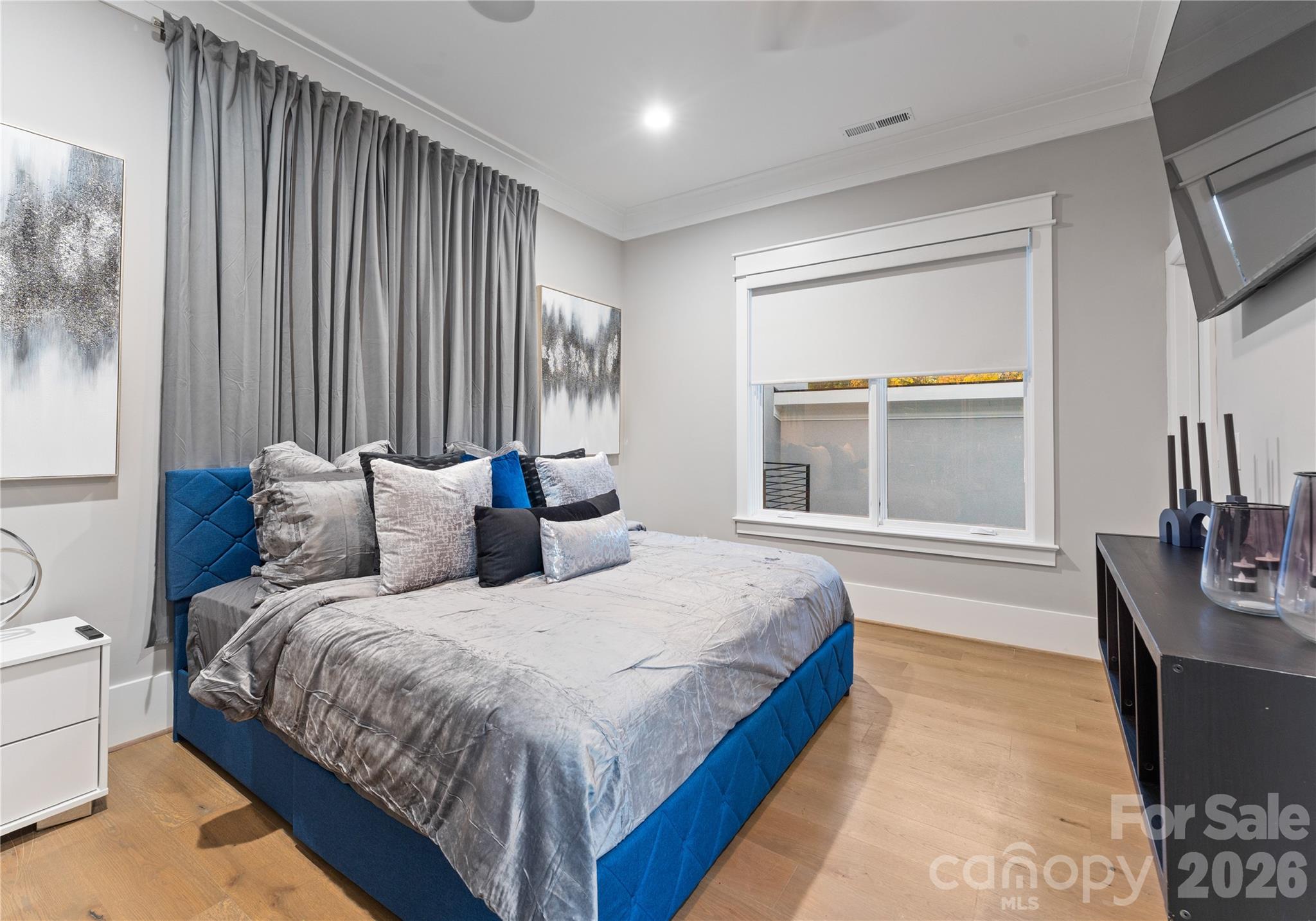 15700 Youngblood Road Charlotte, NC 28278 - Photo 24 of 41 a bedroom with bed and a large window