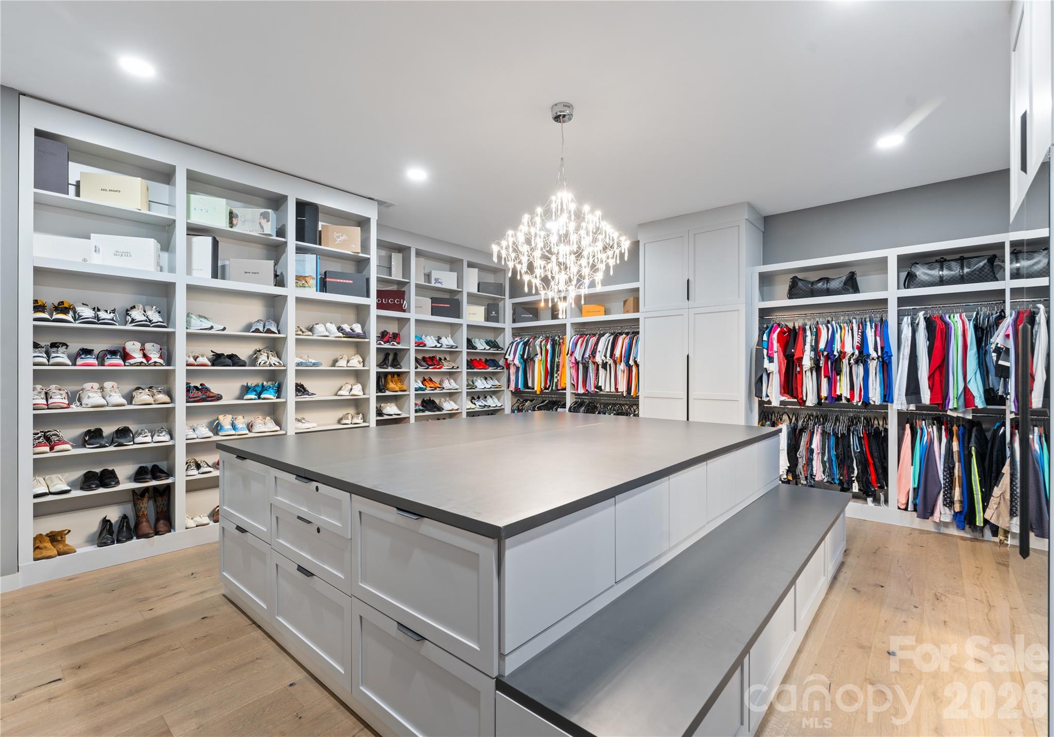15700 Youngblood Road Charlotte, NC 28278 - Photo 3 of 41 a living room with lots of furniture a rug and a book shelf