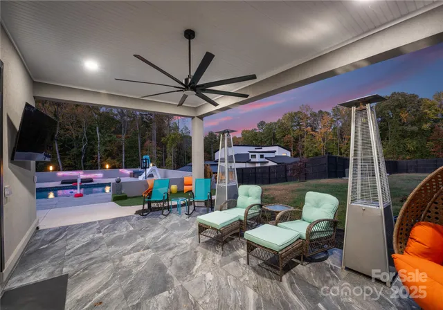 swimming pool view with a seating space