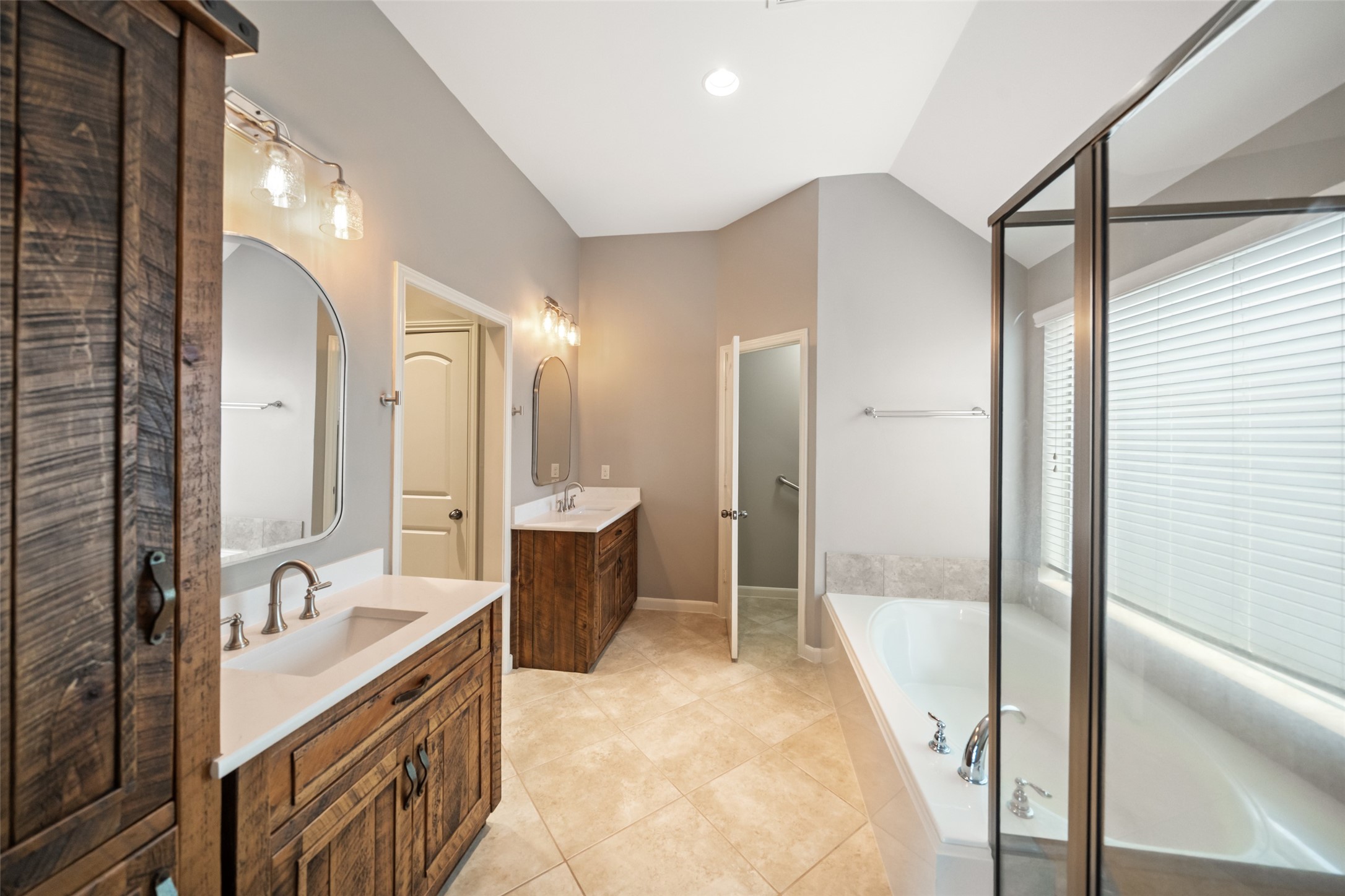 2818 Red Maple Drive Katy, TX 77494 - Photo 38 of 50 a bathroom with a tub sink shower and mirror