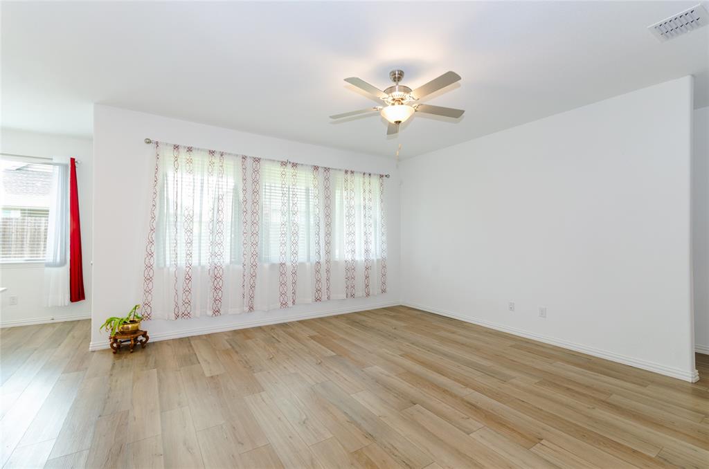 1222 Sequoia Lane Princeton, TX 75407 - Photo 15 of 29 Living room with light wood-style floors, ceiling fan, and baseboards