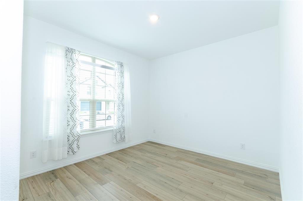 1222 Sequoia Lane Princeton, TX 75407 - Photo 22 of 29 Bedroom # 3 with light wood-type flooring, baseboards, and recessed lighting