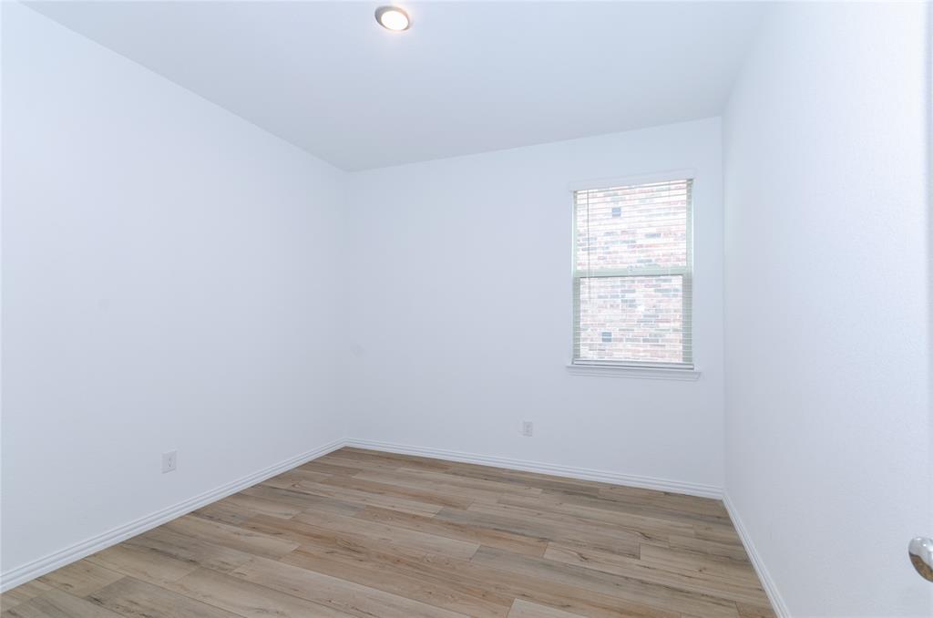 1222 Sequoia Lane Princeton, TX 75407 - Photo 23 of 29 Bedroom # 4 featuring light wood-style floors and baseboards