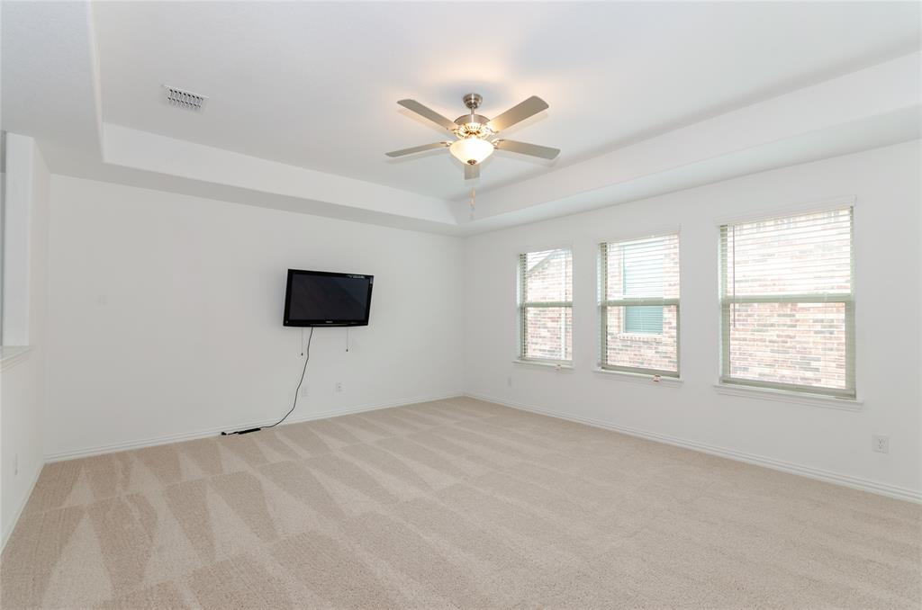 1222 Sequoia Lane Princeton, TX 75407 - Photo 9 of 29 Game room featuring a raised ceiling, light colored carpet, a ceiling fan, and baseboards