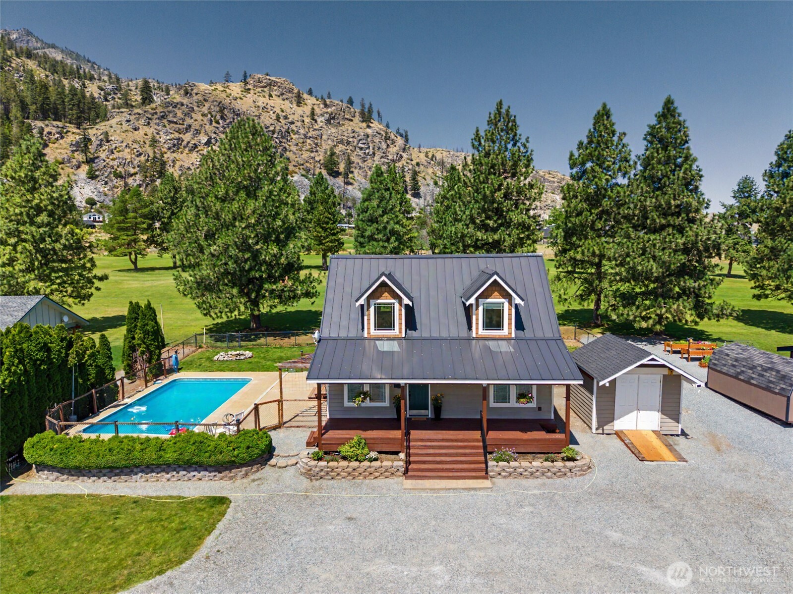 93 Golf Course Drive Pateros, WA 98846 - Photo 1 of 34 a view of a house with a big yard plants and large tree