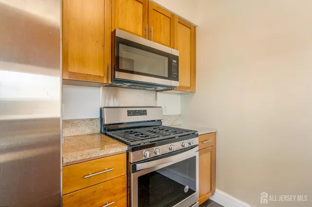 a kitchen with a stove and a microwave