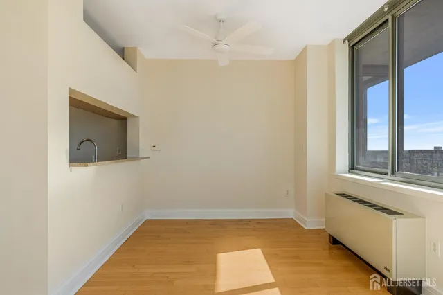 a view of an empty room with a window