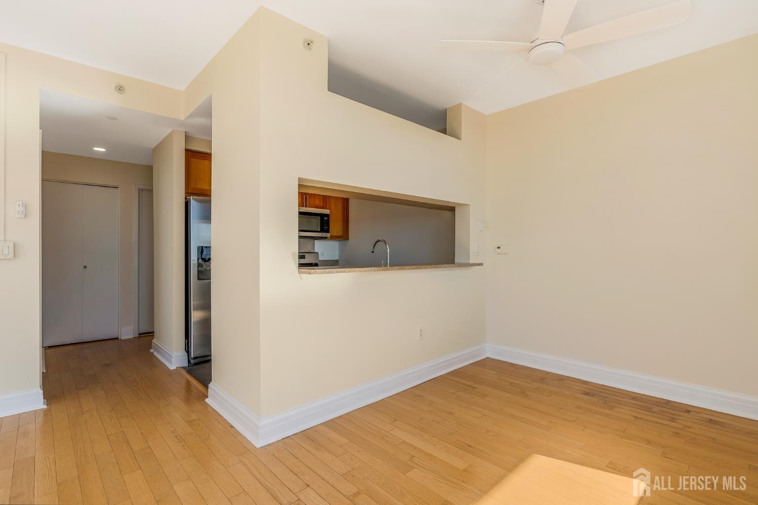 1 Spring Street, Unit 1704 New Brunswick, NJ 08901 - Photo 15 of 44 a view of empty room with wooden floor
