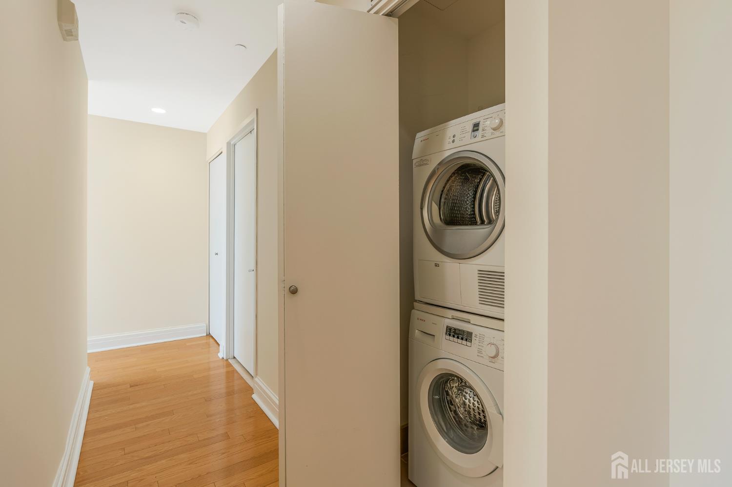 1 Spring Street, Unit 1704 New Brunswick, NJ 08901 - Photo 16 of 44 a utility room with dryer and washer
