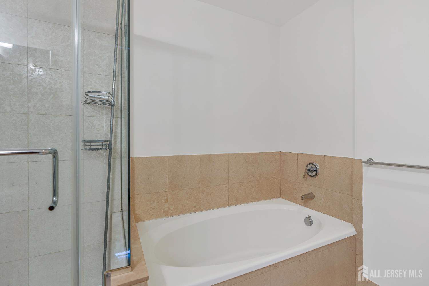 1 Spring Street, Unit 1704 New Brunswick, NJ 08901 - Photo 21 of 44 a bathroom with a bathtub and shower