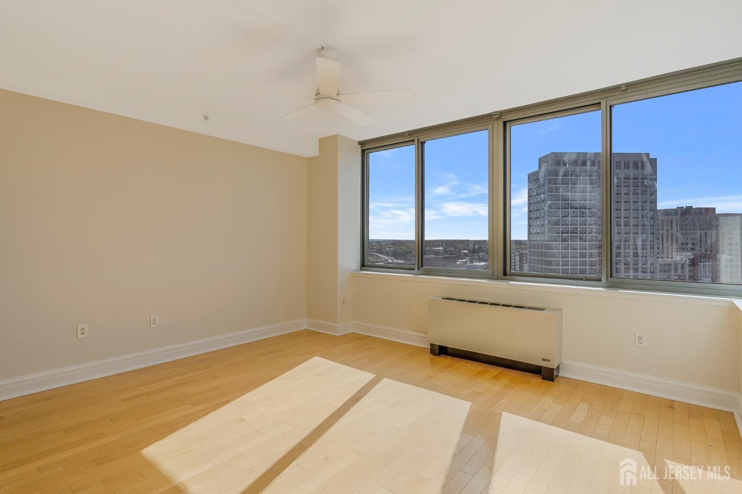1 Spring Street, Unit 1704 New Brunswick, NJ 08901 - Photo 23 of 44 a view of an empty room with a window