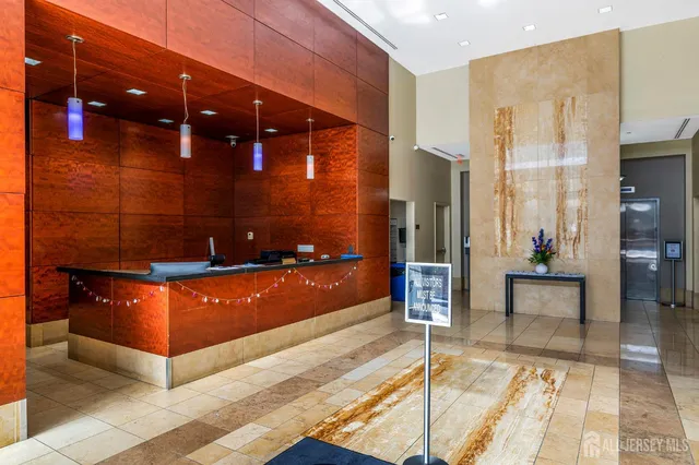 a view of a lobby with a rug and outdoor seating