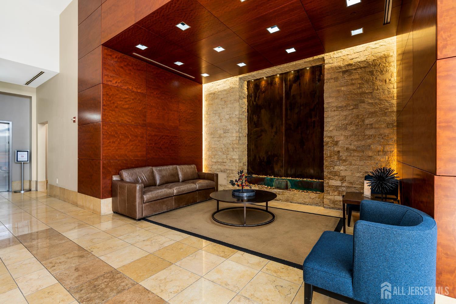 1 Spring Street, Unit 1704 New Brunswick, NJ 08901 - Photo 4 of 44 a outdoor living with furniture and a potted plant