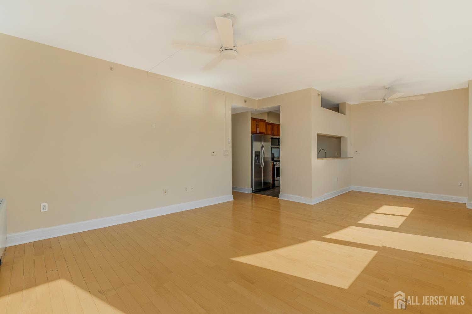 1 Spring Street, Unit 1704 New Brunswick, NJ 08901 - Photo 10 of 44 a view of an empty room with window