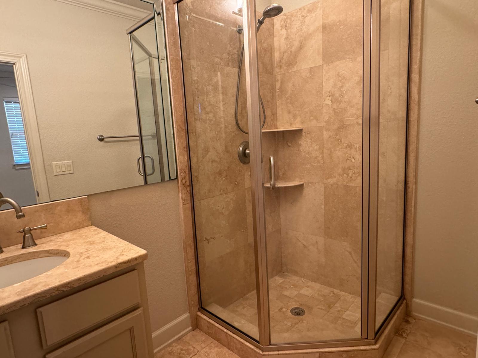 241 Inverrary Drive Destin, FL 32541 - Photo 14 of 24 a bathroom with a granite countertop sink a mirror and shower