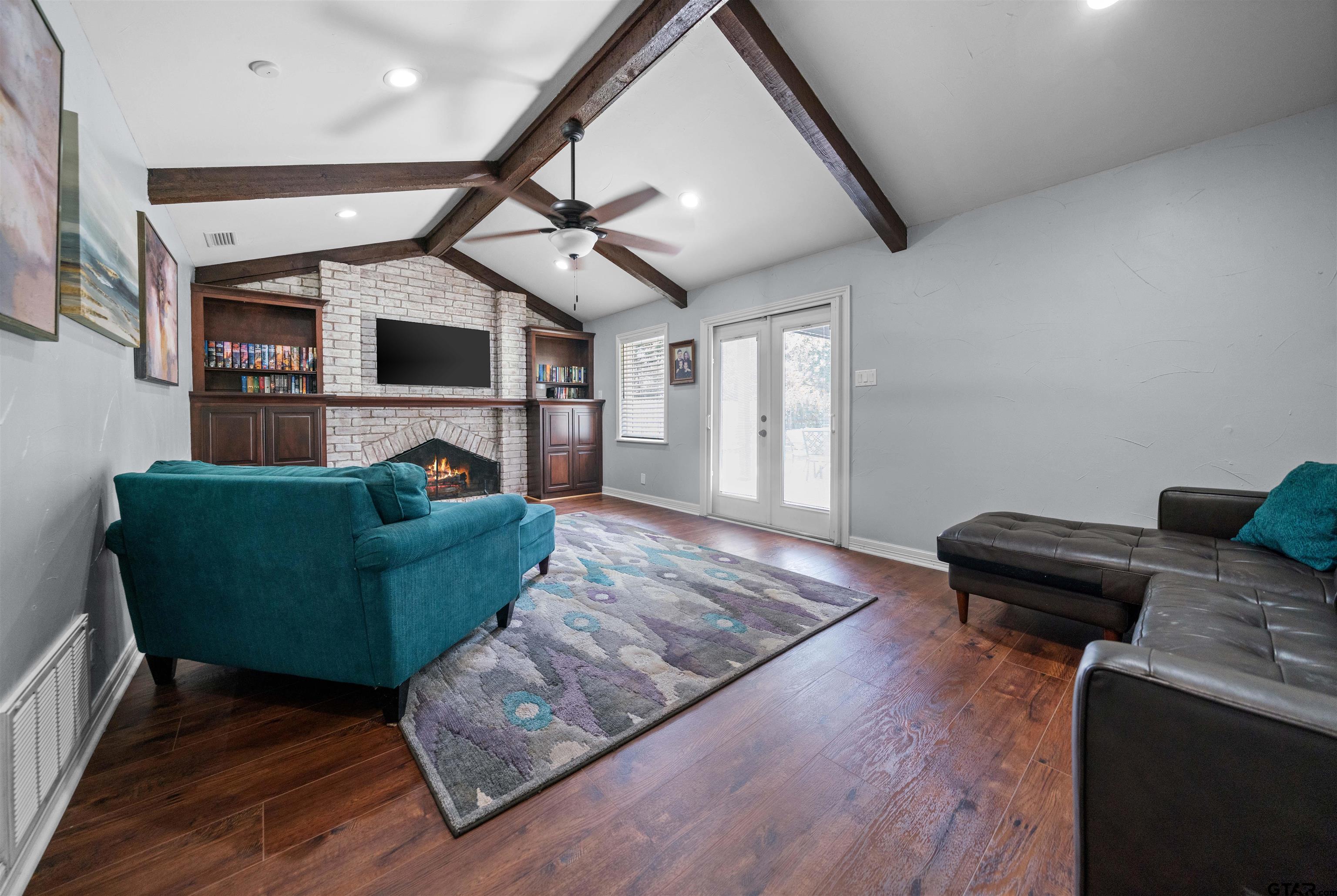 4107 Chester Drive Tyler, TX 75701 - Photo 21 of 45 a living room with furniture and a flat screen tv