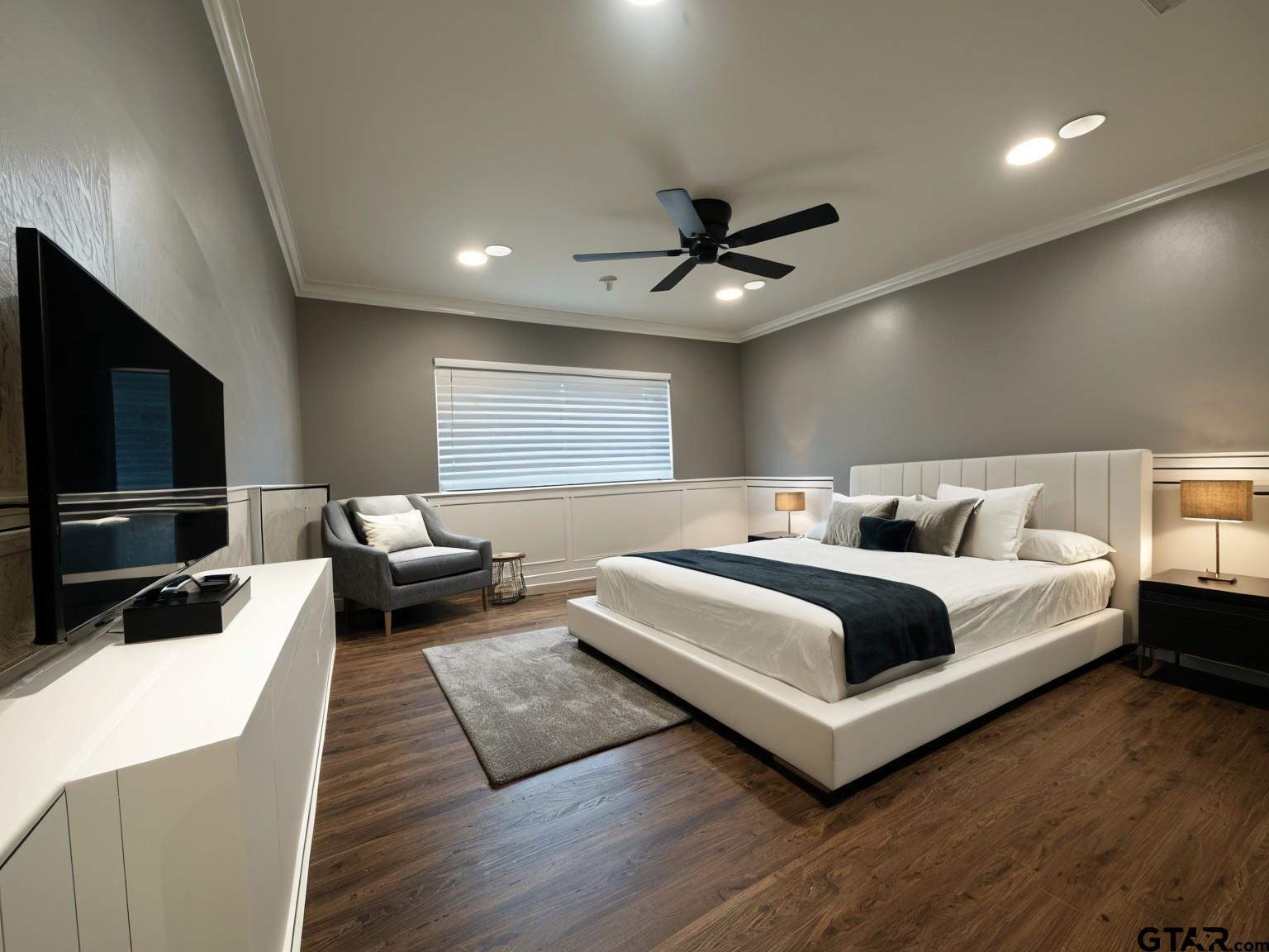 4107 Chester Drive Tyler, TX 75701 - Photo 23 of 45 a bedroom with a bed and a flat screen tv