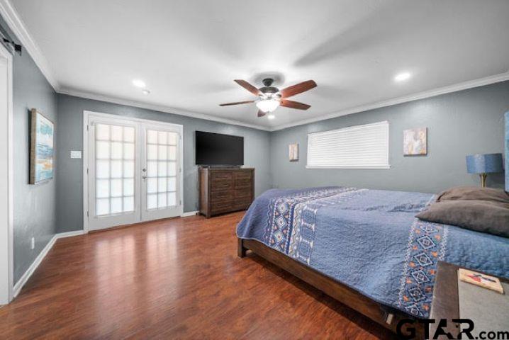 4107 Chester Drive Tyler, TX 75701 - Photo 27 of 45 a bedroom with a bed and a flat screen tv