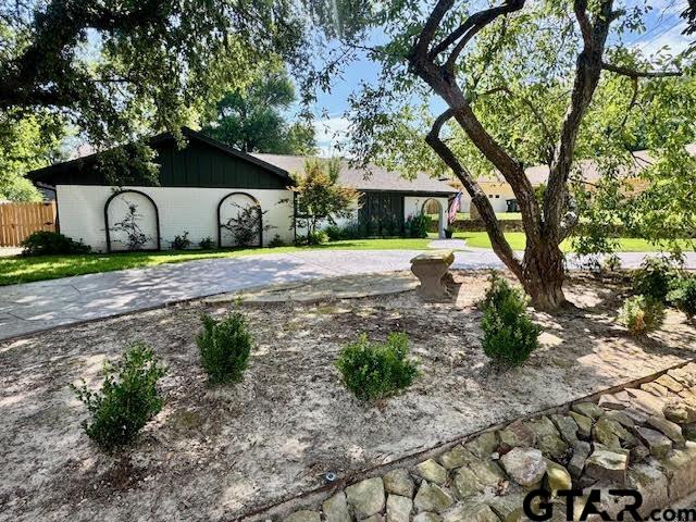 4107 Chester Drive Tyler, TX 75701 - Photo 30 of 45 a front view of a house with garden