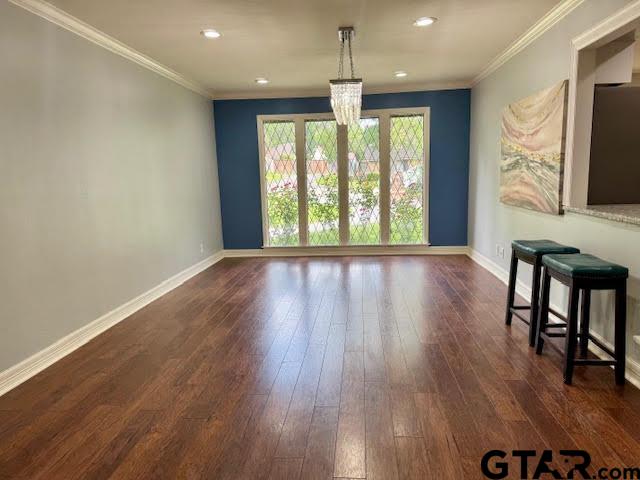 4107 Chester Drive Tyler, TX 75701 - Photo 7 of 45 a view of an empty room with wooden floor and a window