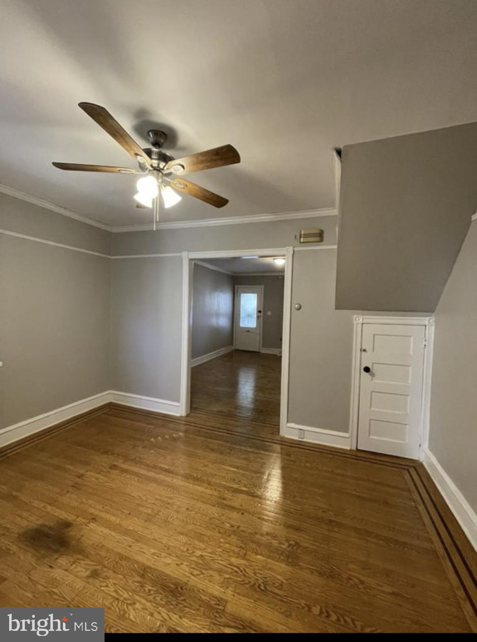 5616 Christian Street Philadelphia, PA 19143 - Photo 4 of 12 a view of empty room with wooden floor