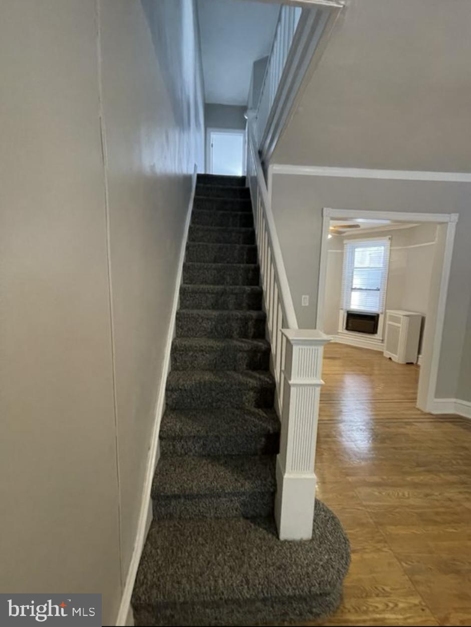 5616 Christian Street Philadelphia, PA 19143 - Photo 7 of 12 a view of entryway and hall with wooden floor