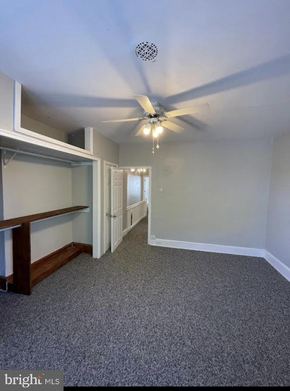 5616 Christian Street Philadelphia, PA 19143 - Photo 9 of 12 a view of an empty room with a ceiling fan