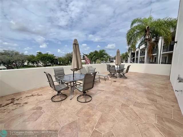 a view of a terrace with furniture