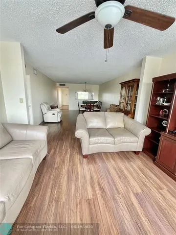 a view of living room with furniture and fireplace
