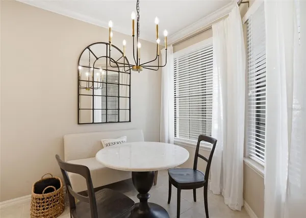 a view of a dining room with furniture and window