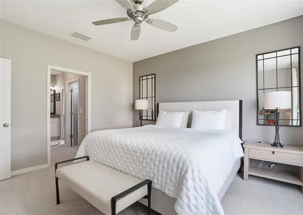 a bedroom with a bed and window