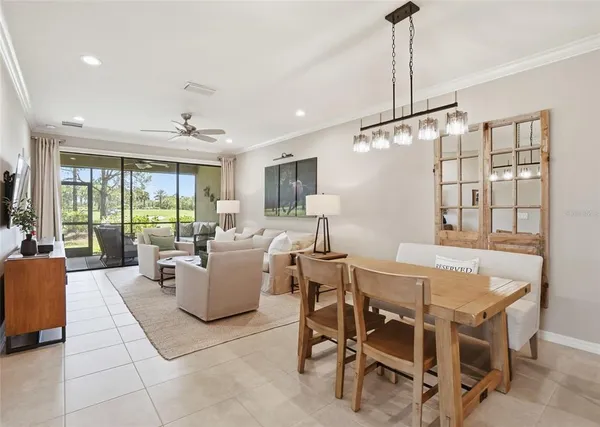 a dining room with furniture and window