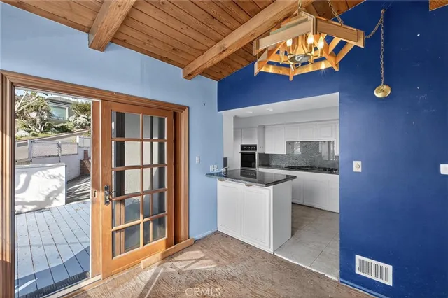 a kitchen with stainless steel appliances granite countertop a stove and a refrigerator