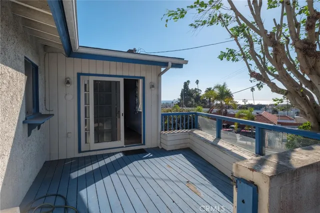 a view of balcony with wooden floor
