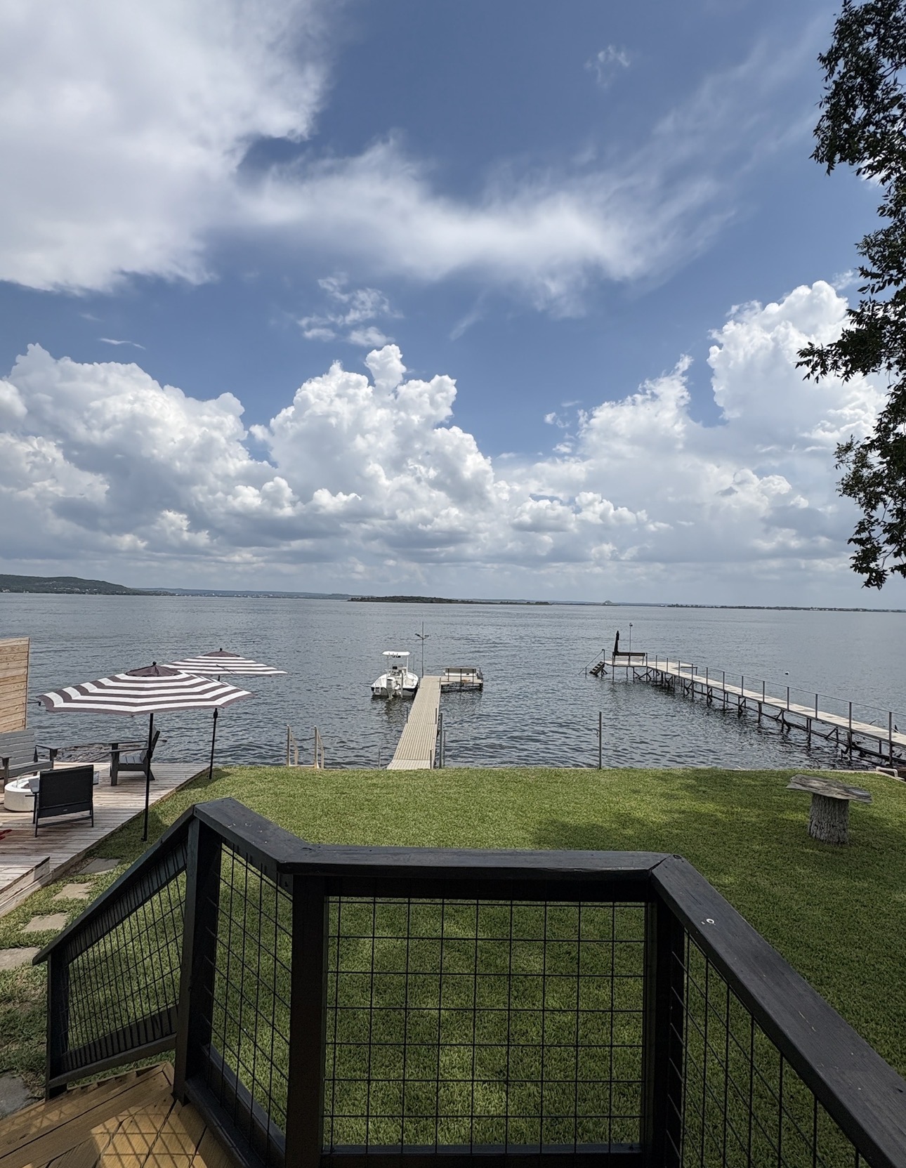 a terrace with outdoor seating and city view