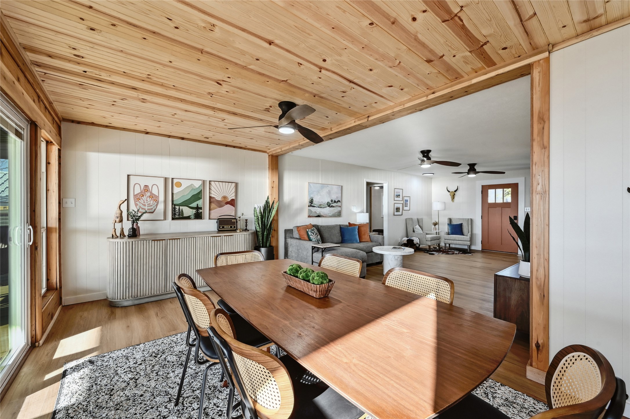 611 Lakeshore Loop Tow, TX 78672 - Photo 11 of 40 Dining room featuring wooden ceiling, wood finished floors, ceiling fan, and wood walls