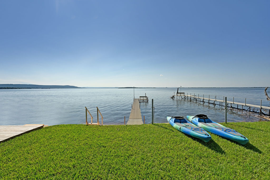 611 Lakeshore Loop Tow, TX 78672 - Photo 26 of 40 Dock area featuring a yard and a water view