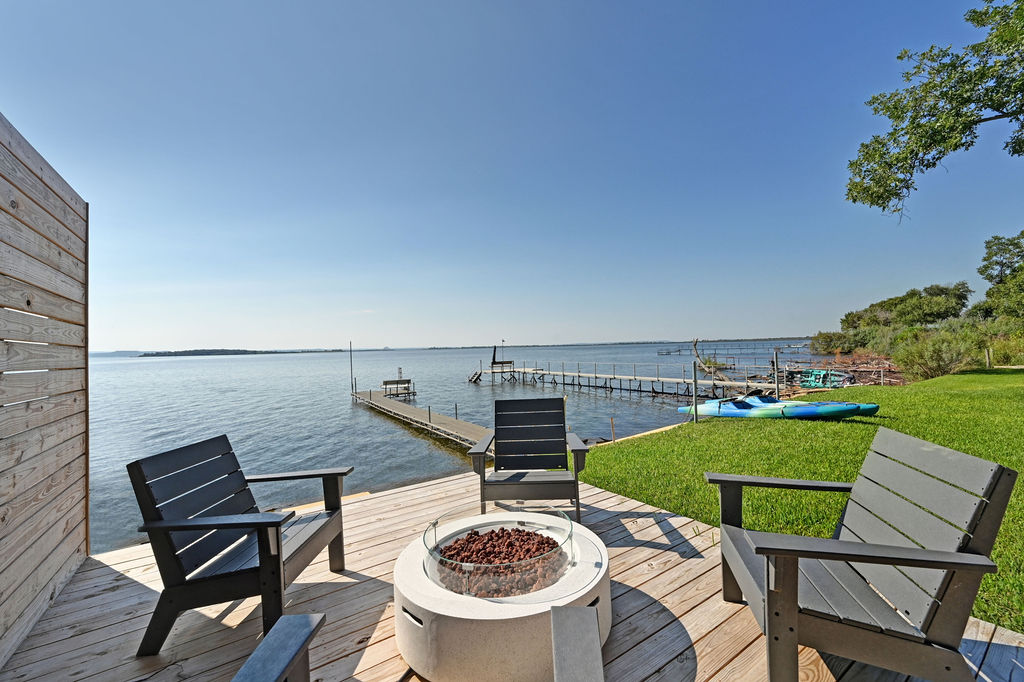 611 Lakeshore Loop Tow, TX 78672 - Photo 28 of 40 Dock featuring a water view, a fire pit, and a yard