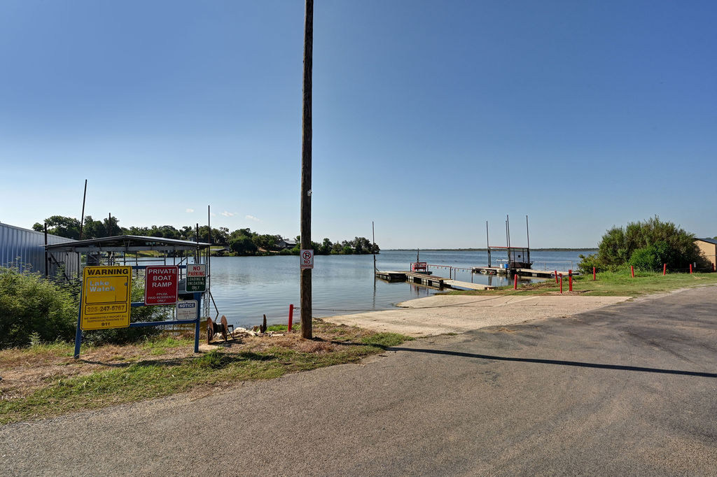 611 Lakeshore Loop Tow, TX 78672 - Photo 38 of 40 Water view with a boat ramp and a dock