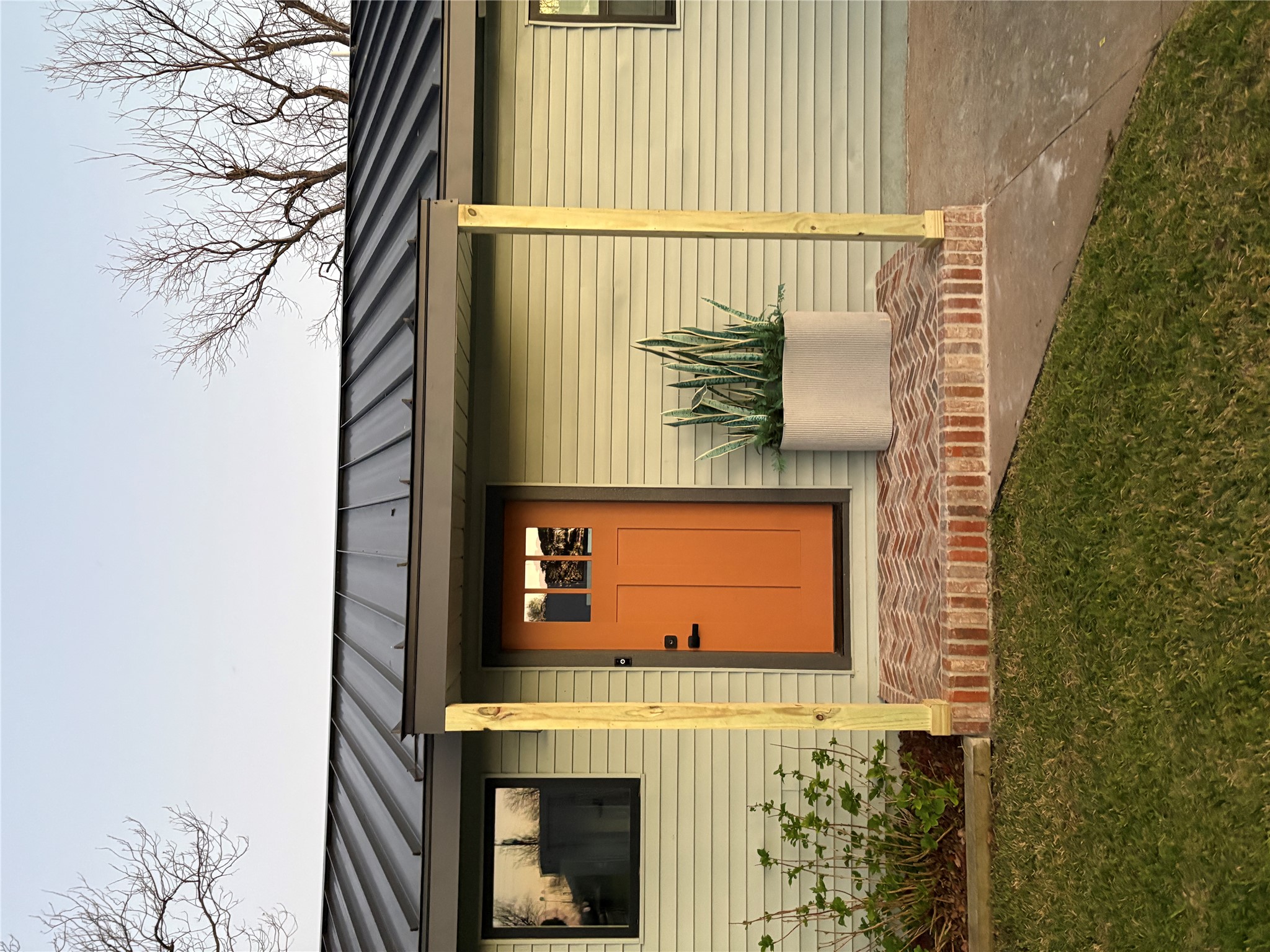 611 Lakeshore Loop Tow, TX 78672 - Photo 39 of 40 Entrance to property featuring a standing seam roof and a lawn
