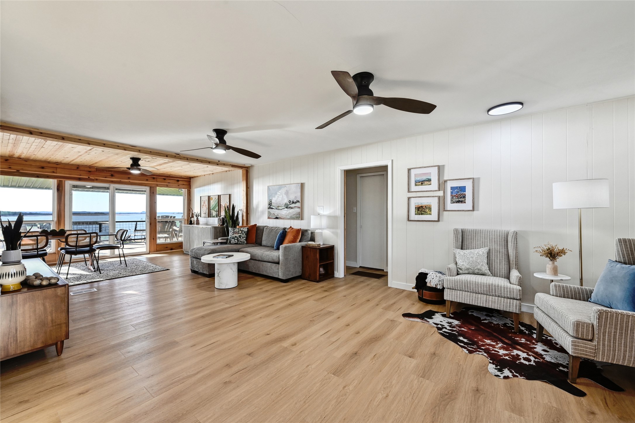 611 Lakeshore Loop Tow, TX 78672 - Photo 4 of 40 Living area with light wood finished floors and ceiling fan
