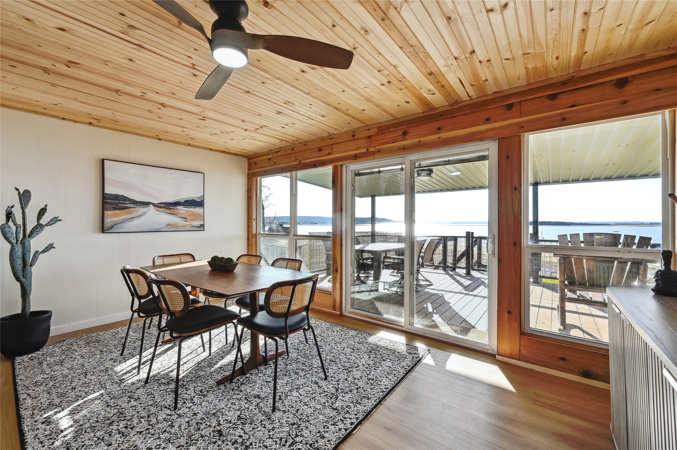 611 Lakeshore Loop Tow, TX 78672 - Photo 10 of 40 Dining room featuring a ceiling fan, wooden ceiling, light wood-type flooring, and a water view