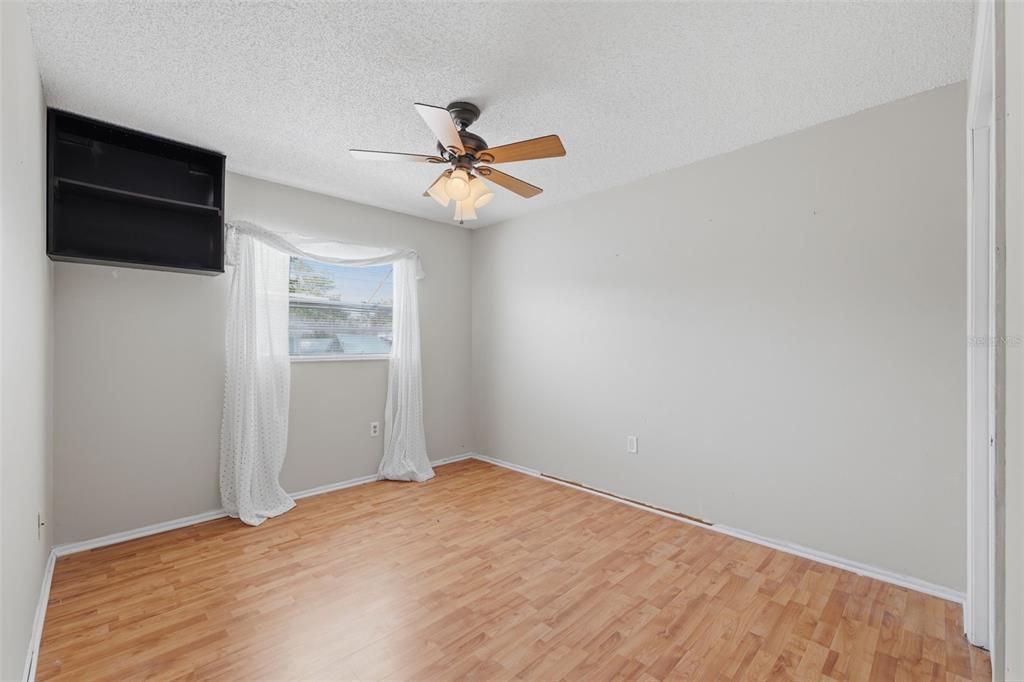 12265 Shafton Road Spring Hill, FL 34608 - Photo 19 of 58 a view of a big room with a ceiling fan and a ceiling fan