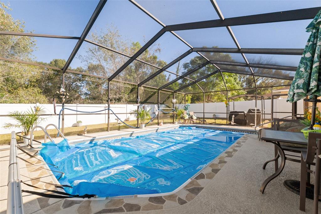 12265 Shafton Road Spring Hill, FL 34608 - Photo 20 of 51 a view of a swimming pool with a yard