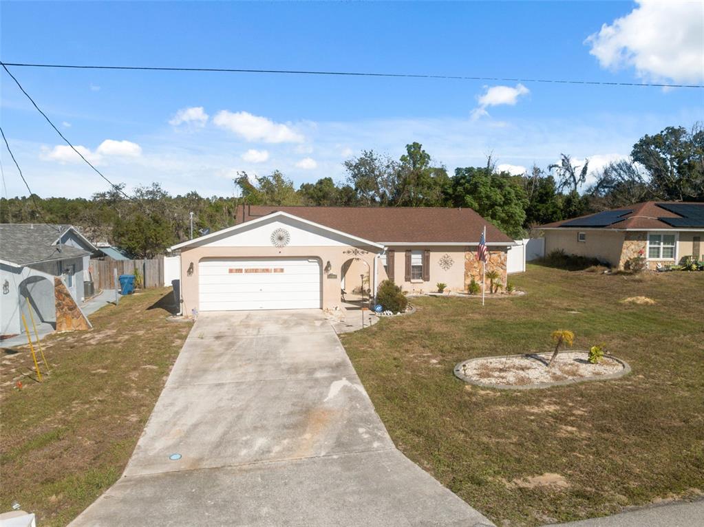 12265 Shafton Road Spring Hill, FL 34608 - Photo 29 of 51 a view of a house with a yard
