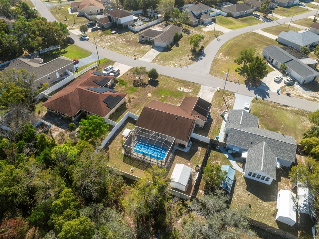 12265 Shafton Road Spring Hill, FL 34608 - Photo 38 of 58 an aerial view of multiple houses with yard